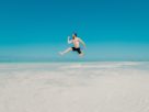 Man Jumping On Beach